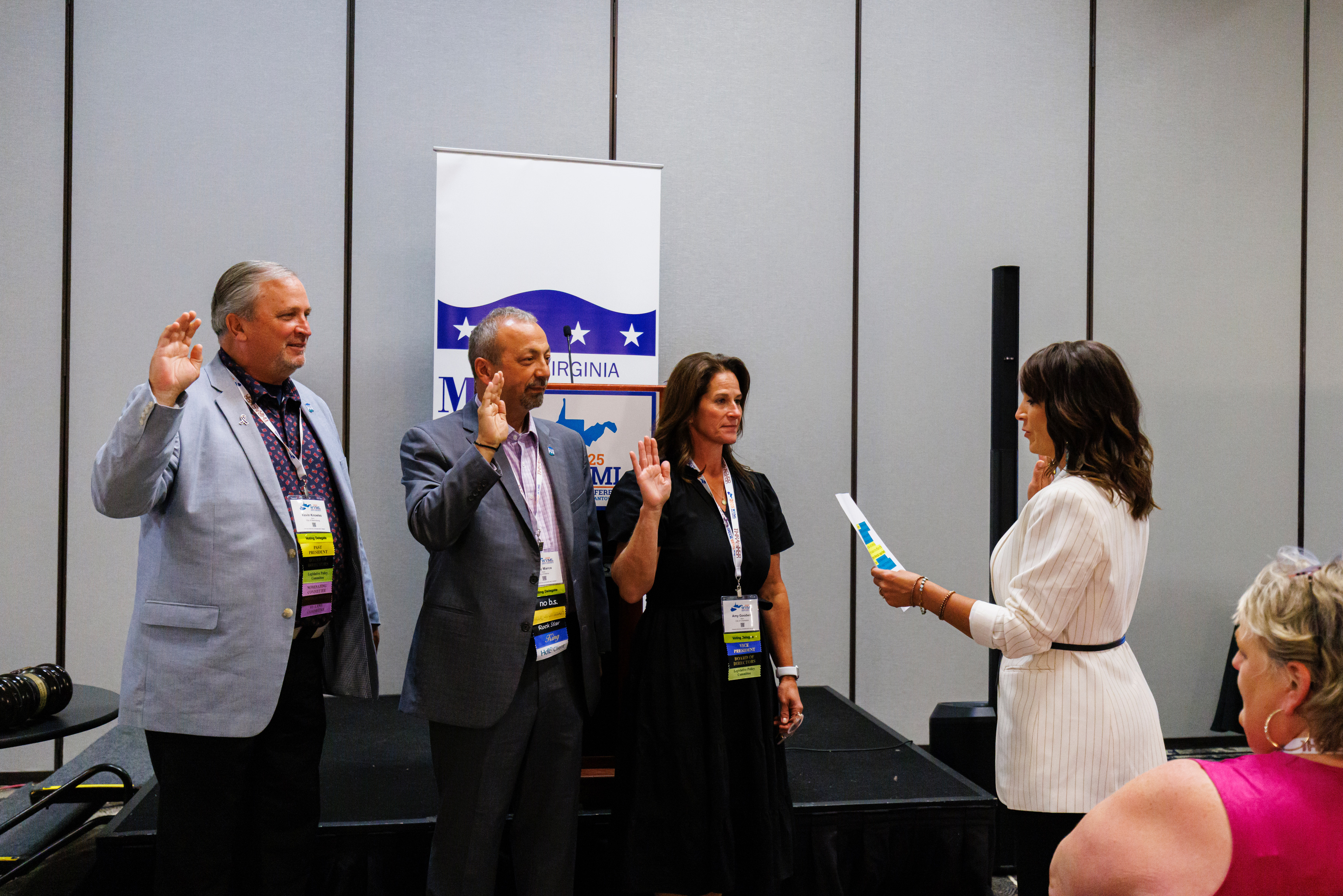 Mayor Kevin Knowles (Martinsburg), Mayor Jerry Marco (Elkins), and Mayor Amy Shuler Goodwin (Charleston) are sworn in by City Manager Misty Hill (Lewisburg). 